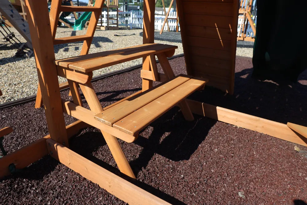 backyard playground with green vinyl canopy