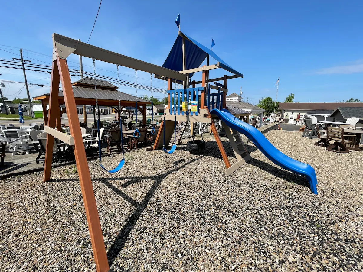 swing set with blue slide