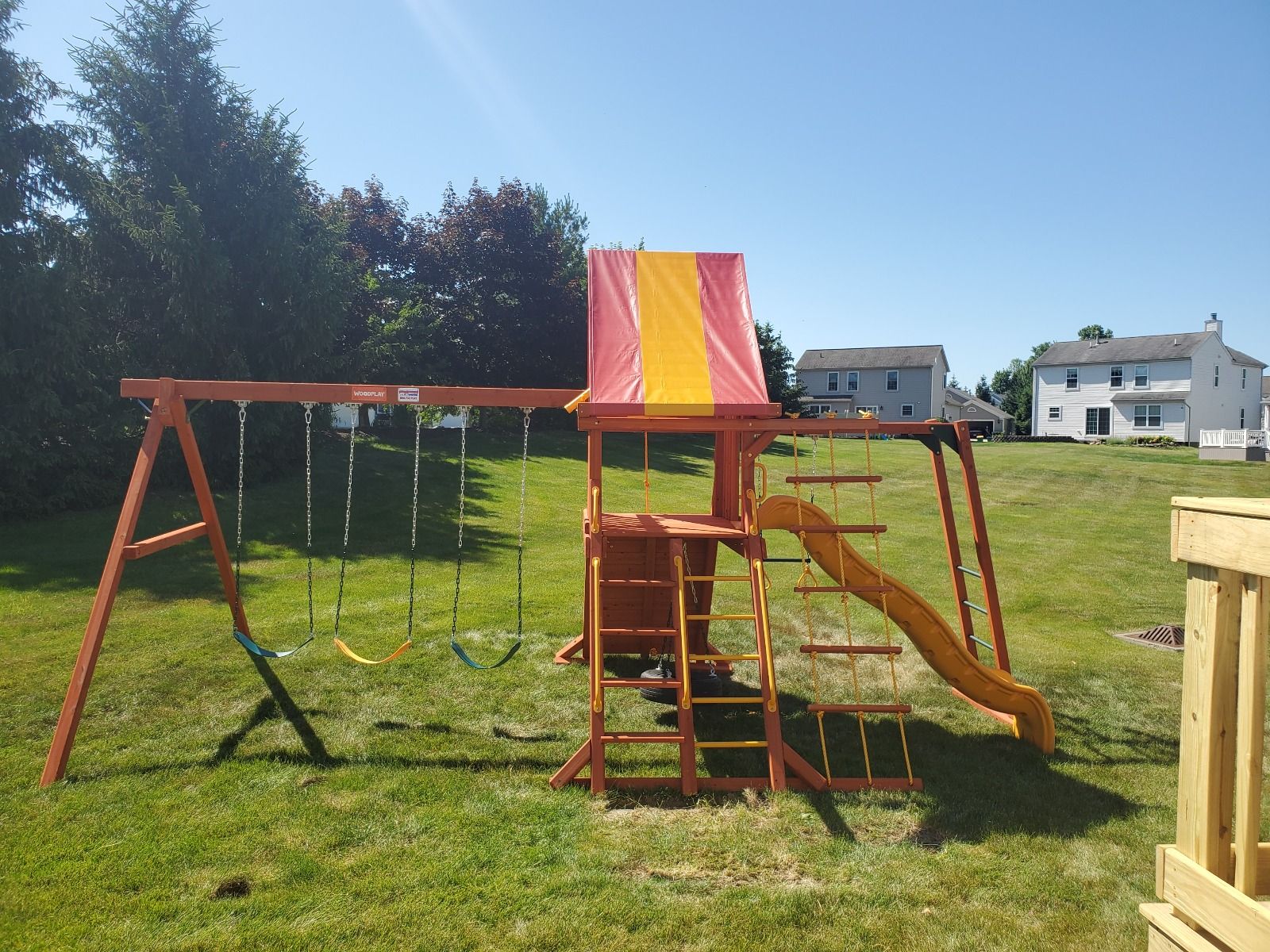 wooden playhouse swing set