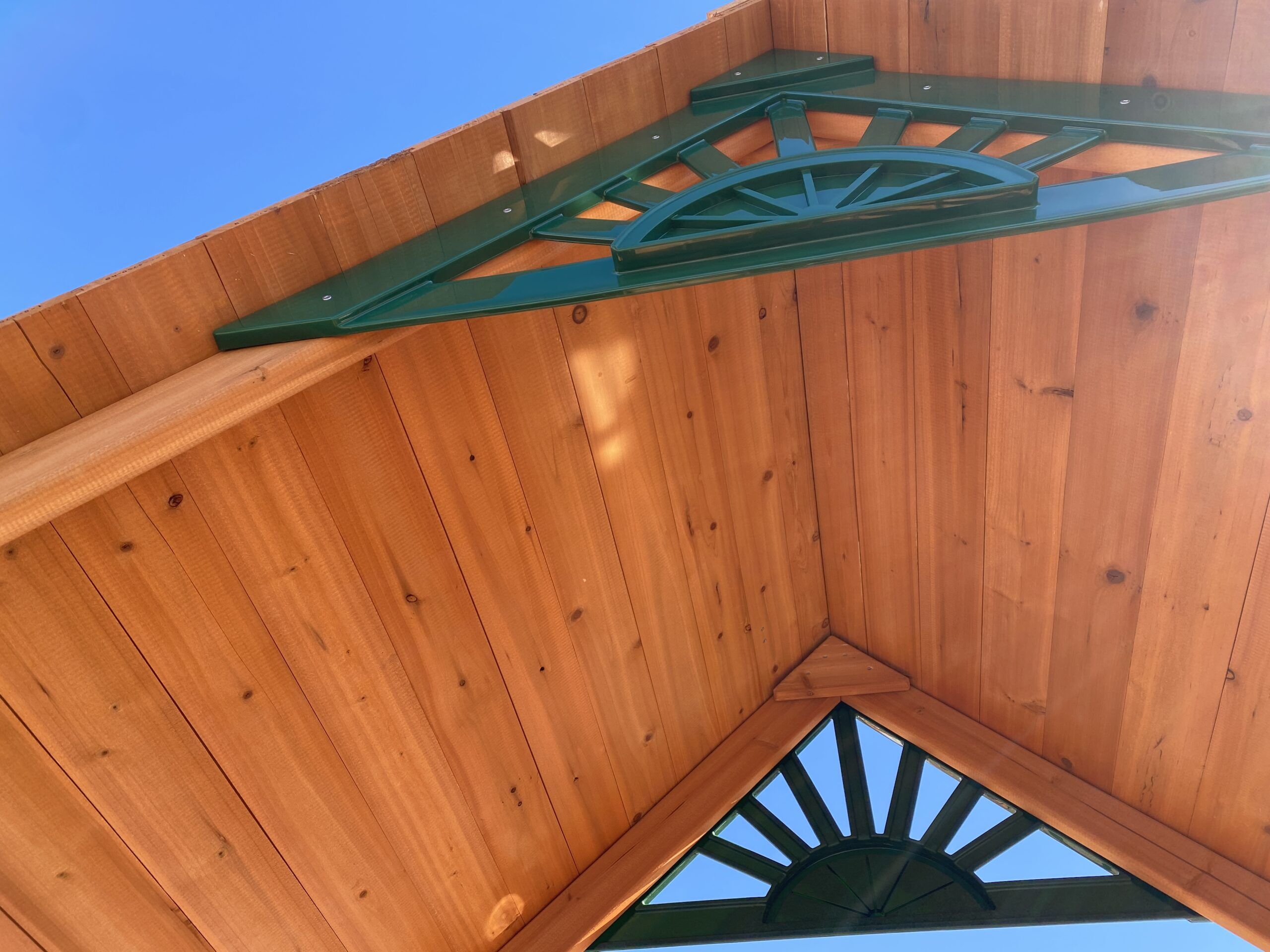 swing set with spiral slide with wood peak roof